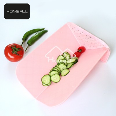 Multifunctional foldable fruit and vegetable strainer chopping board